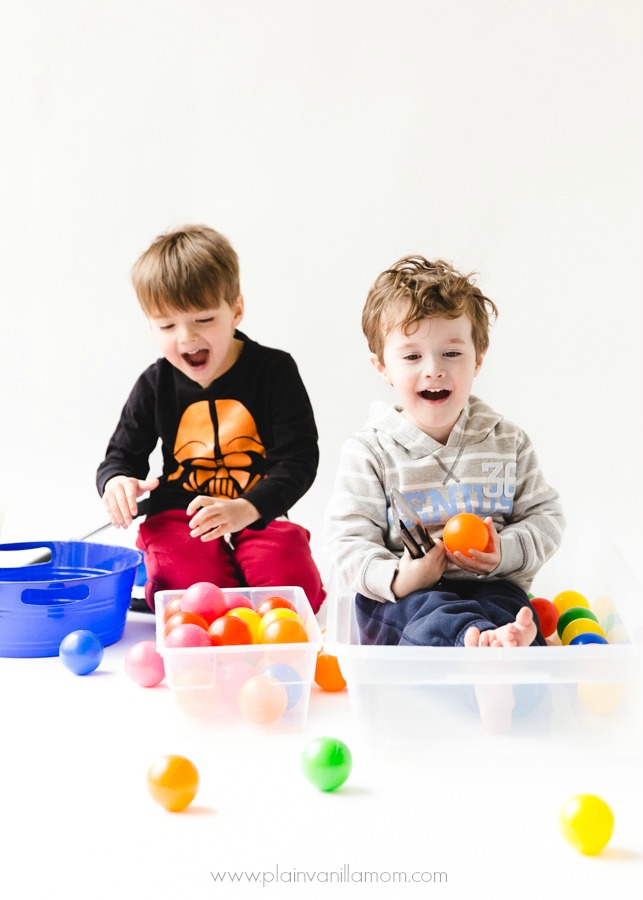 kids playing ball pit ball transfer game