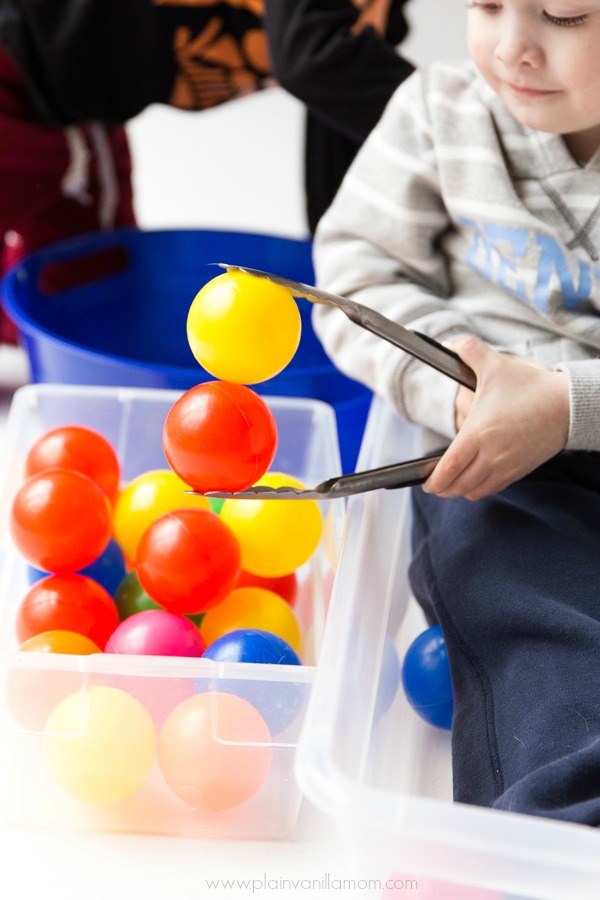 tongs and ball pit balls
